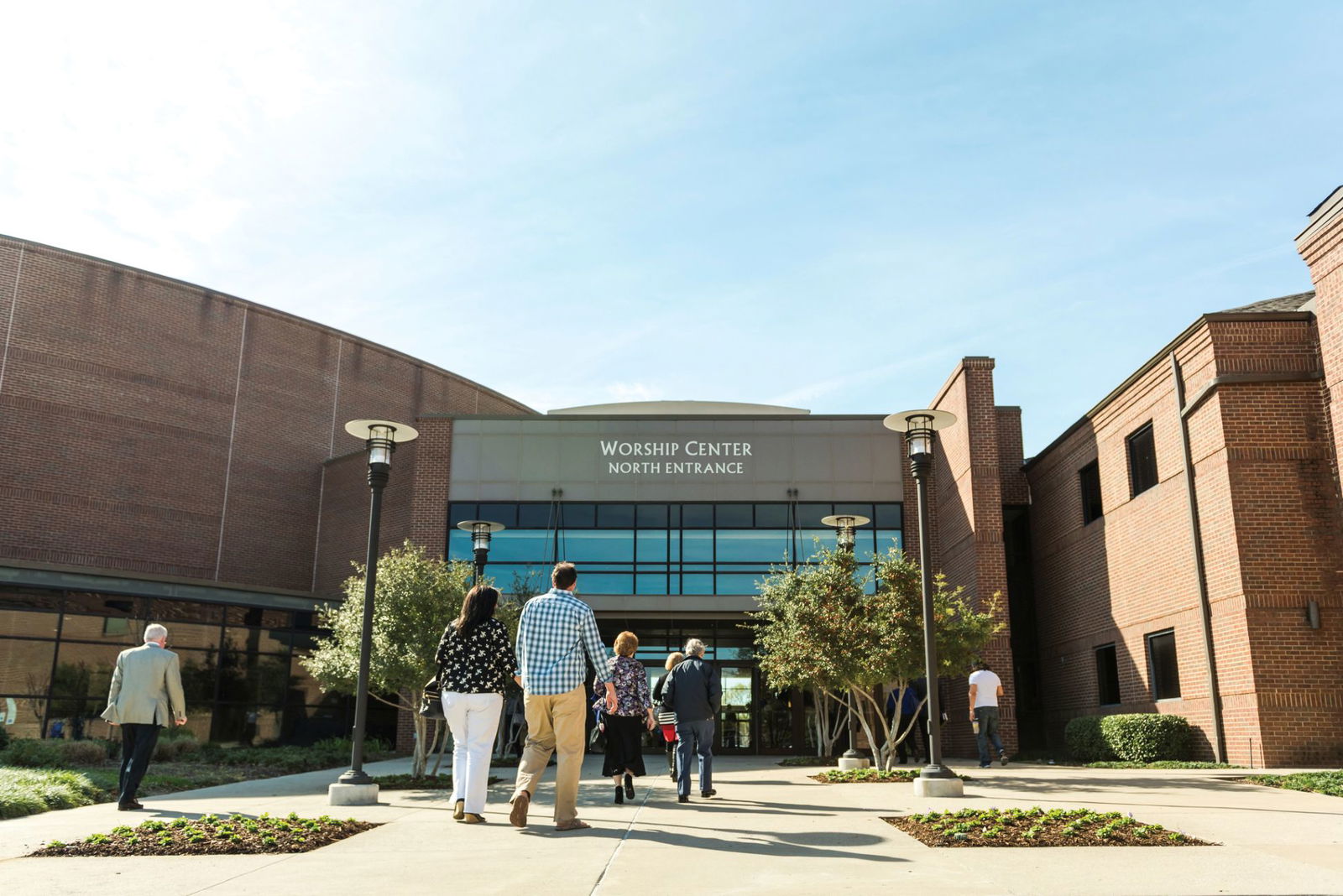 Woman smiling looking at a computer screen