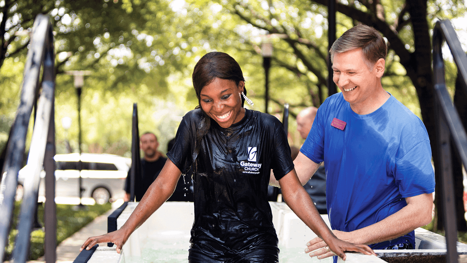 A girl smiling while be water baptised